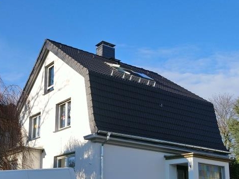 Dachausbau und Fassadengestaltung Einfamilienhaus